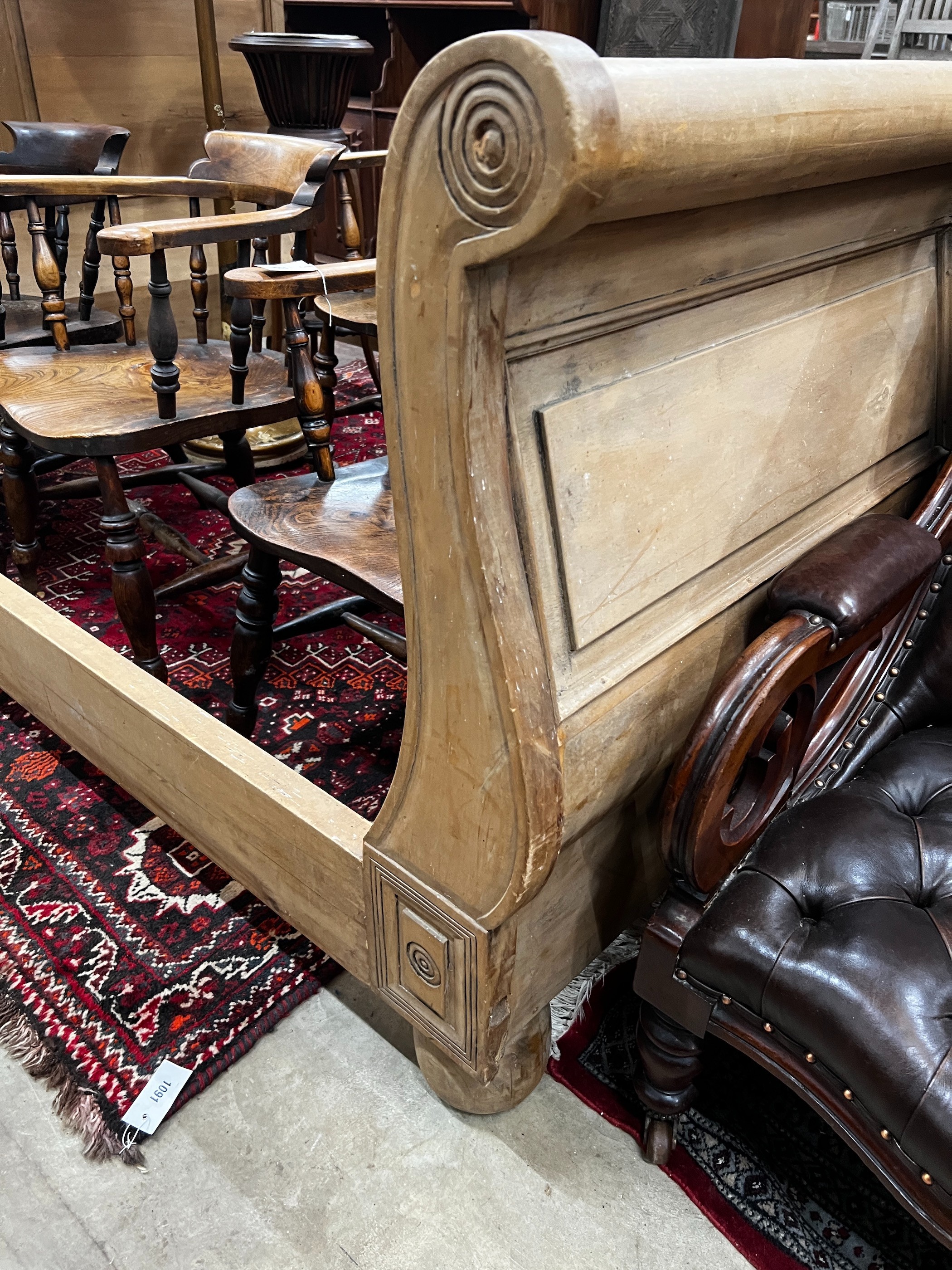 A pine sleigh bed frame, width 161cm, length 240cm, height 120cm